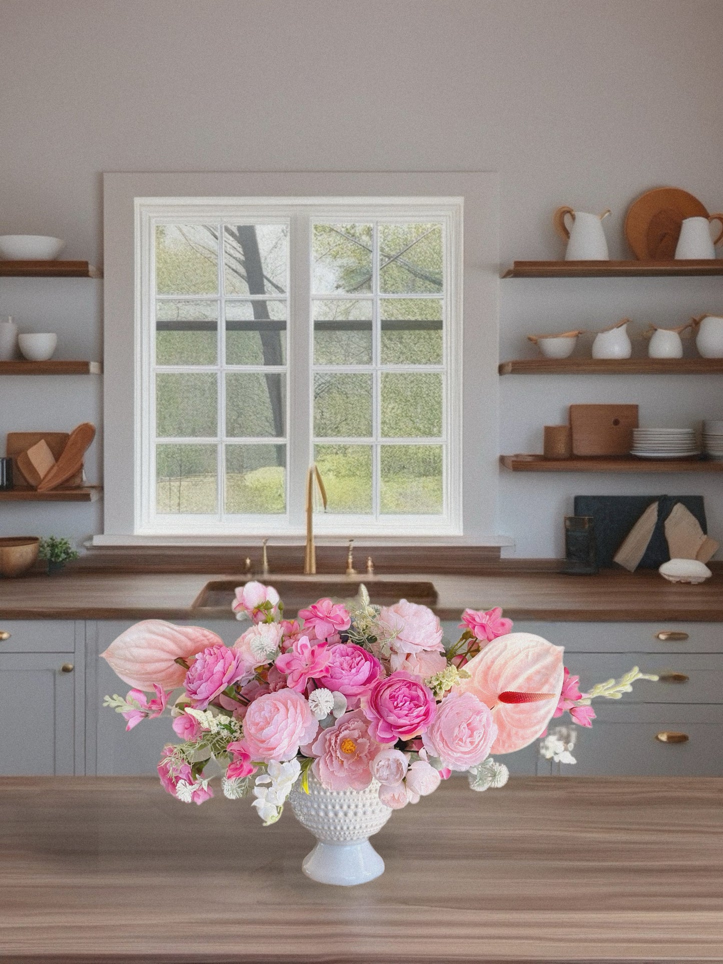 Pink romantic style bouquet with peonies and roses in a ceramic vase