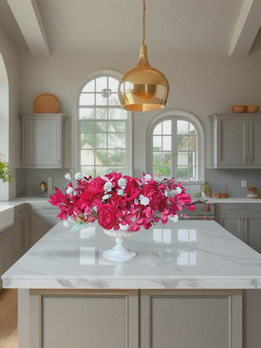 Kitchen with a bouquet of pink flowers on a marble countertop
