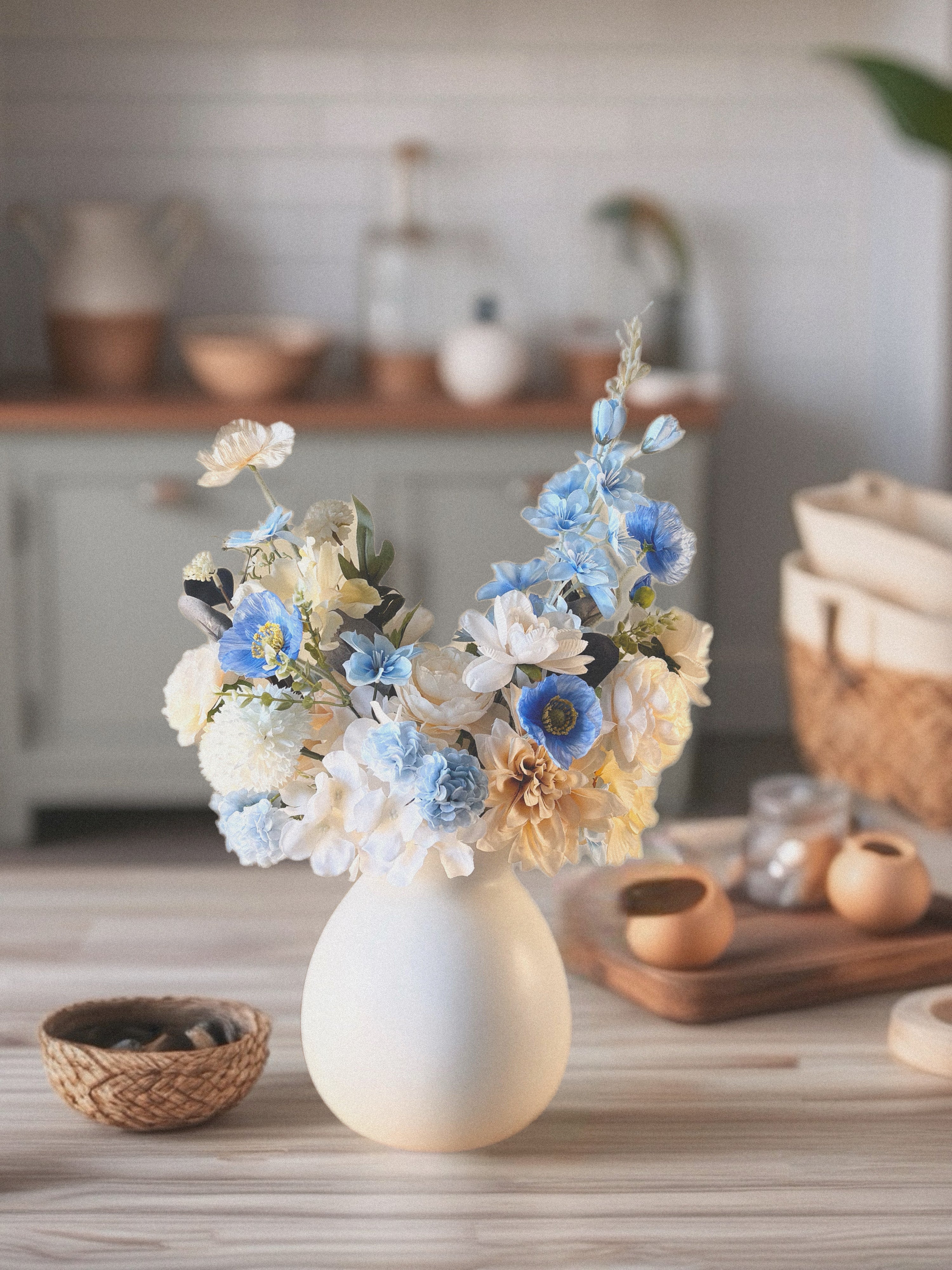 Decorative vase with flowers on a kitchen counter