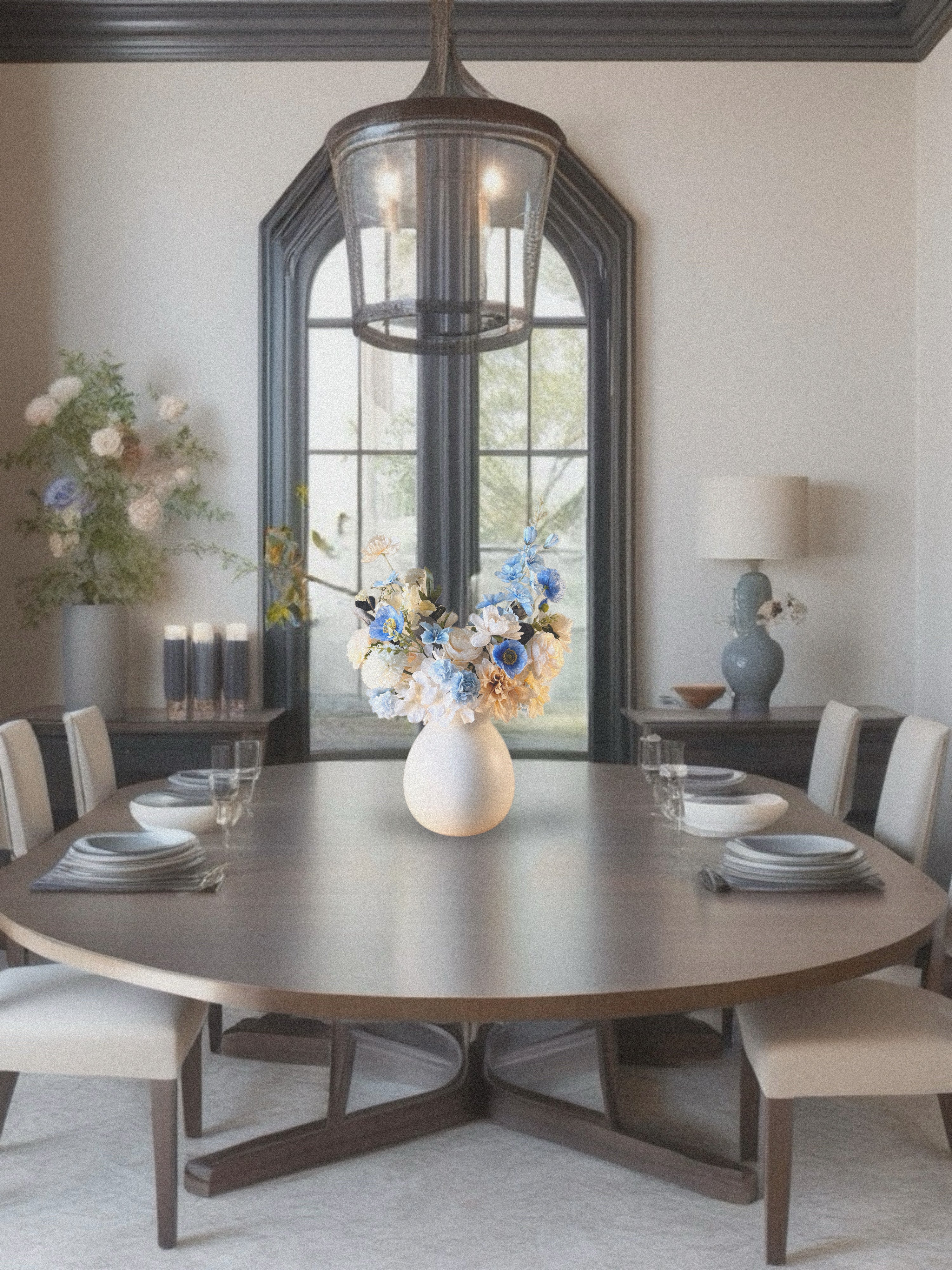 Dining room with a round wooden table, chairs, and decorative elements.