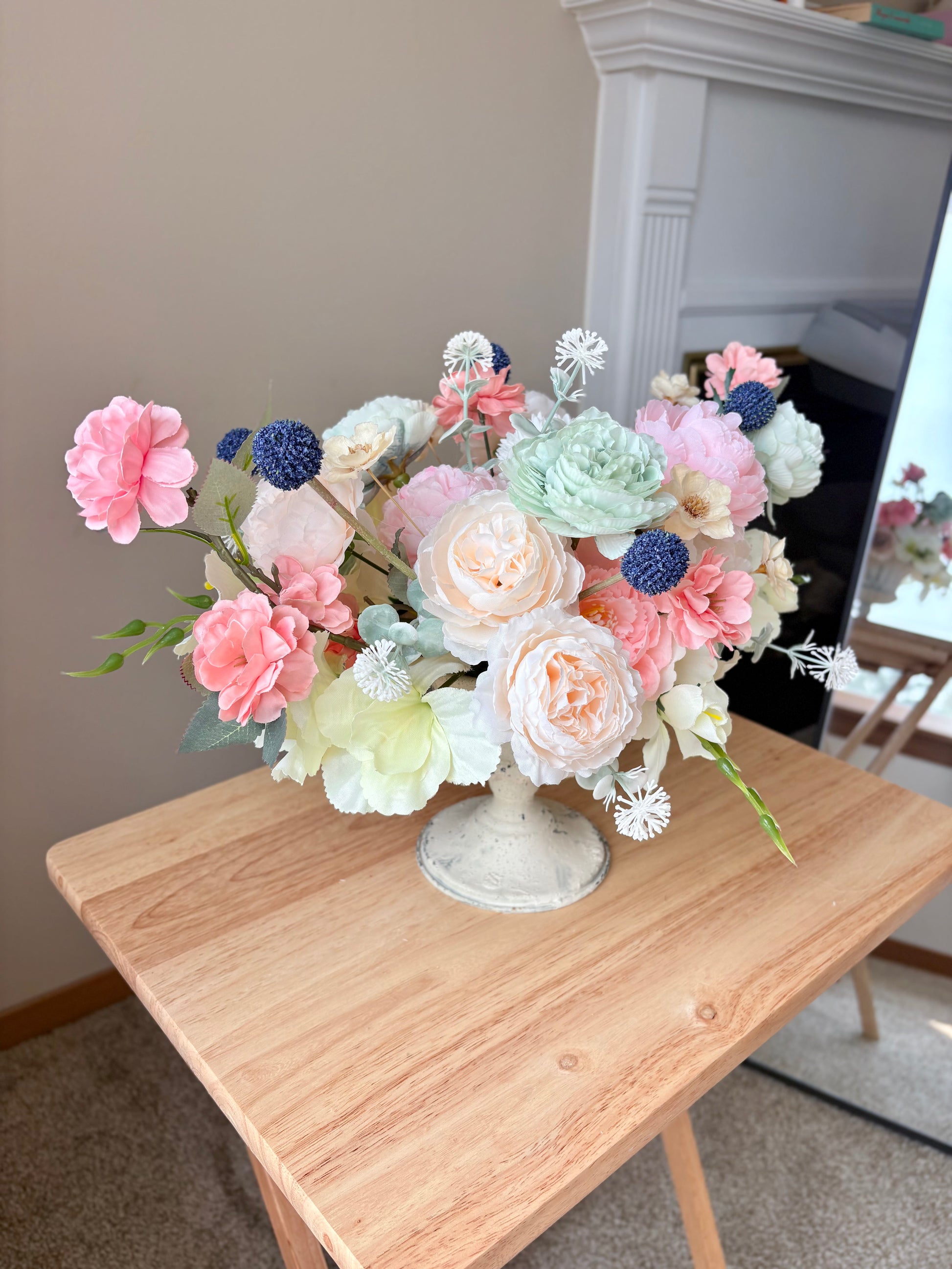 Bouquet of flowers in a vase on a wooden table