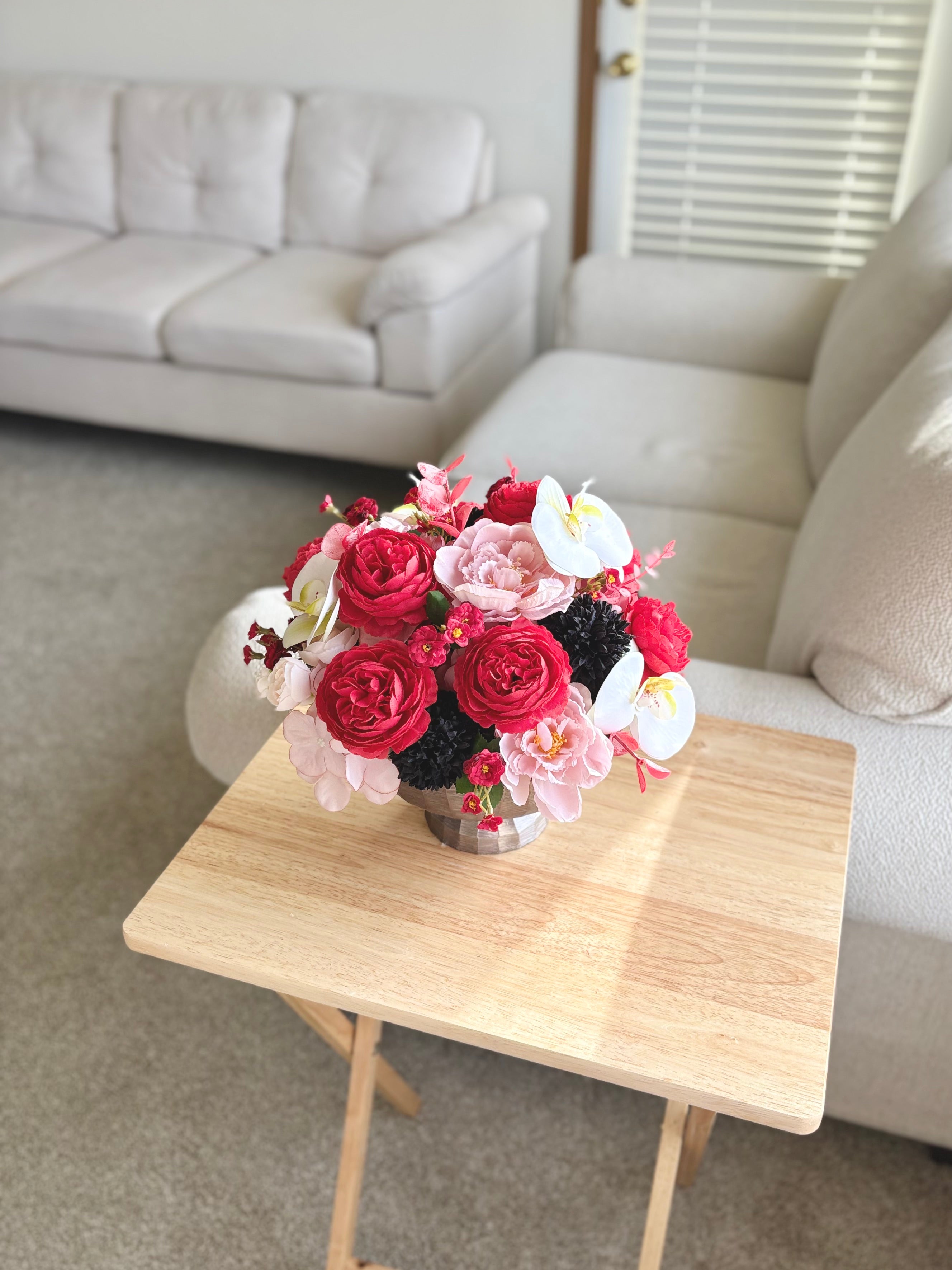 Bouquet of flowers on a wooden table in a living room setting